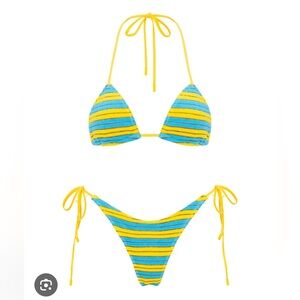 NWT triangl bikini. NEVER WORN IN PERFECT CONDITION! Size medium top and bottom.